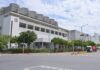 Nvidia owes nothing to anyone, except the ground it is built on L'usine Fab 18 de TSMC dans le parc scientifique du sud de Taïwan, vue depuis la rue, avec ses tours de refroidissement sur le toit et des camions à l'entrée