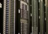 Digital Resilience Index: how long can you hold out? A row of server racks in a data centre, with cables and status lights