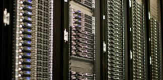 Digital Resilience Index: how long can you hold out? A row of server racks in a data centre, with cables and status lights
